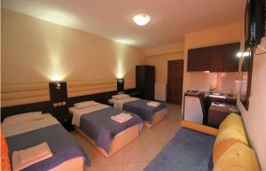A bed or beds in a room at Panorama Spa Hotel
