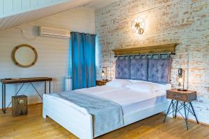 Ein Bett oder Betten in einem Zimmer der Unterkunft St Anastasia Hotel