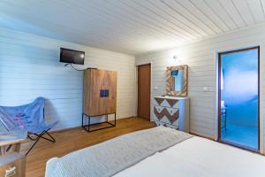 Ein Bett oder Betten in einem Zimmer der Unterkunft St Anastasia Hotel