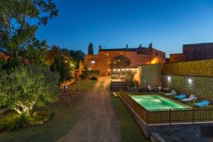 a house with a swimming pool in the yard at Can Nentia in Fonteta