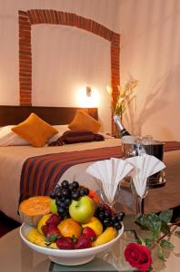 A bed or beds in a room at La Casona Hotel Boutique