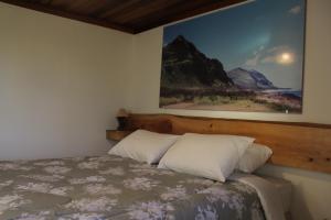 En eller flere senger på et rom på Abrigo da Reserva