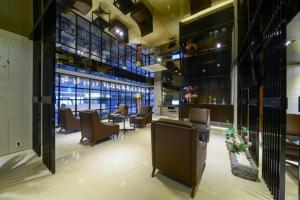 a salon with chairs and tables in a building at Life Style S Hotel in Seoul