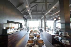 a restaurant with a buffet of food on a table at Tonsai Bay Resort in Tonsai Beach