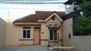 a small house being built with at SleepRest - Plamo Garden in Batam Center