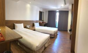 Katil atau katil-katil dalam bilik di Hotel W