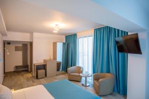 TV a/nebo společenská místnost v ubytování Belleview Suites + 26 fotografií