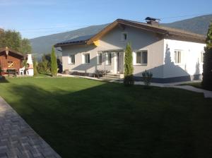 a house with a large lawn in front of it at Ferienhaus Holiday in Radstadt