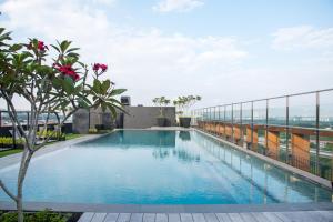 a swimming pool on the roof of a building at MTREE Hotel in Puchong