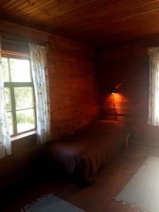 Ein Bett oder Betten in einem Zimmer der Unterkunft Paali cottages
