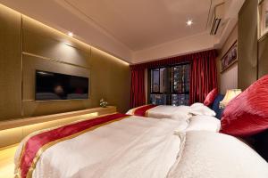 Heefun International Apartment - Zhujiang New Town FuLi Brand New World Plaza客房内的一张或多张床位