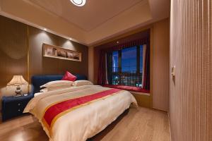 Heefun International Apartment - Zhujiang New Town FuLi Brand New World Plaza客房内的一张或多张床位