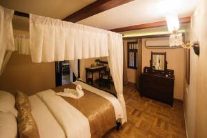 Postel nebo postele na pokoji v ubytování Casa Menezes - A Heritage Goan Homestay