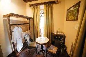 Postel nebo postele na pokoji v ubytování Casa Menezes - A Heritage Goan Homestay