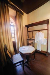 Postel nebo postele na pokoji v ubytování Casa Menezes - A Heritage Goan Homestay