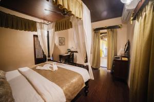 Postel nebo postele na pokoji v ubytování Casa Menezes - A Heritage Goan Homestay