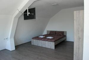 a bedroom with a couch in a stair room at Madzar Apartments in Star Dojran +34 photos