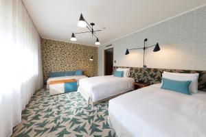 Postel nebo postele na pokoji v ubytování Karuizawa Prince Hotel East