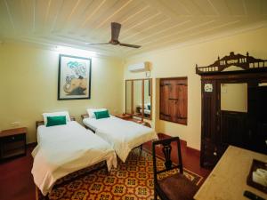 Postel nebo postele na pokoji v ubytování Casa Menezes - A Heritage Goan Homestay