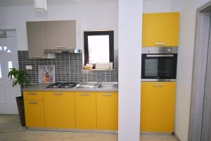 Kuchyň nebo kuchyňský kout v ubytování Jovich Apartments 2