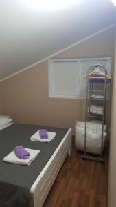 Postel nebo postele na pokoji v ubytování Apartments Lena