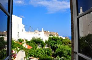 a view of a city from a window at Margarita Hotel in Kythira