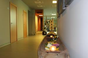 a boat in a hallway with flowers in it at Golden Residence Hotel in Funchal