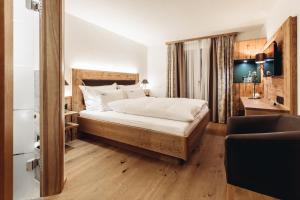 Postel nebo postele na pokoji v ubytování Hotel Spescha