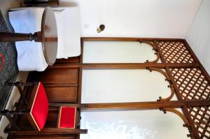 a view from the top of a room with some chairs at Margarita Hotel in Kythira