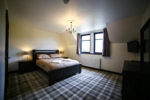 a bedroom with a bed and a window at Whitehouse B&B in Fort Augustus