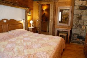 Postel nebo postele na pokoji v ubytování Albergo Diffuso Zoncolan