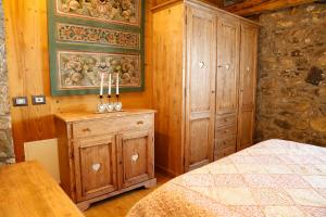 Postel nebo postele na pokoji v ubytování Albergo Diffuso Zoncolan