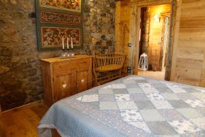 Postel nebo postele na pokoji v ubytování Albergo Diffuso Zoncolan