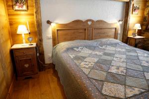 Postel nebo postele na pokoji v ubytování Albergo Diffuso Zoncolan