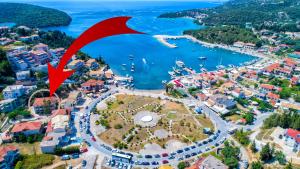 an aerial view of a city with a harbor at Hotel Oriana - Adults Only in Syvota