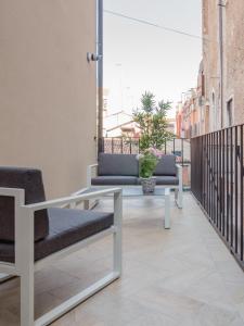 
a bench sitting in the middle of a sidewalk at Luxury Apartment On Grand Canal in Venice

