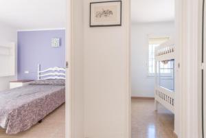 a bedroom with a bed and a staircase in it at Apartaments Fincasol in L'Estartit +46 photos