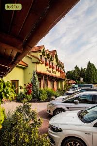 a row of cars parked in front of a building at Penzion Termal in Bojnice