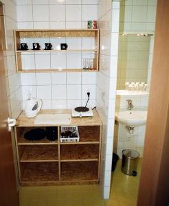 a small bathroom with a sink and a sink at Motel Dacice in Dačice