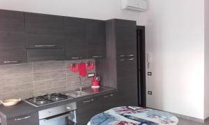 A kitchen or kitchenette at Rooms Loru