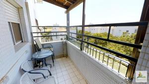 a balcony with two chairs and a table at Raanana Luxury Apartments in Ra‘ananna