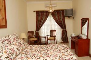 Letto o letti in una camera di Falcon Crest Suites