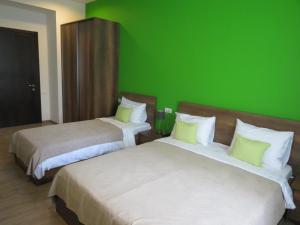 Postel nebo postele na pokoji v ubytování Your Home Hotel