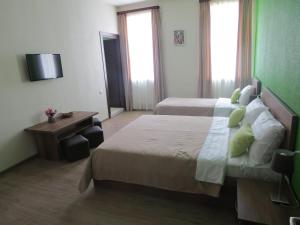 Postel nebo postele na pokoji v ubytování Your Home Hotel