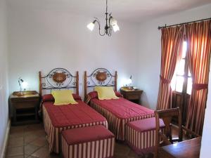 Postel nebo postele na pokoji v ubytování Hotel Cortijo Las Grullas