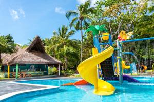 a pool at a resort with a slide at Tivoli Ecoresort Praia do Forte in Praia do Forte