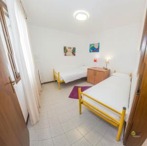 Albergo Diffuso Balcone sul Friuliにあるベッド