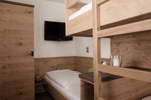 A bed or beds in a room at Hotel Tauernhof