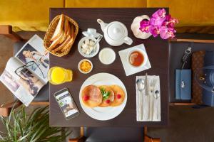 a table with a plate of food on it at Easy Room in Nizhny Novgorod