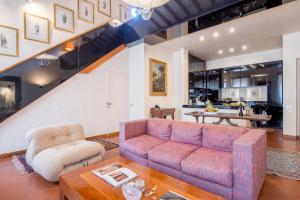 a living room with a couch and a table at Prestige Signoria by Mmega in Florence
